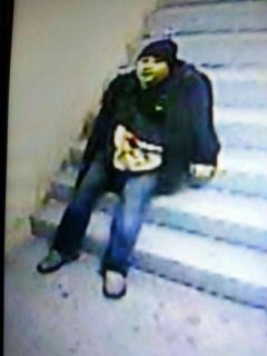 The alleged gunman while sitting on a flgiht of stairs inside Resorts World Manila.  Photo released by the Southern Police District.