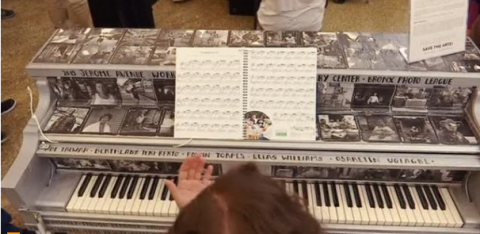 The sound from 60 colorfully painted pianos playing a Johann Sebastian Bach prelude filled a New York City plaza on Monday (June 5).(photo grabbed from Reuters video)